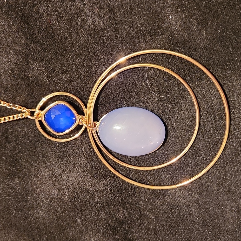 An old navy blue and baby blue pendant gold color necklace 30 inches long
